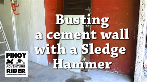 Breaking a Cement Wall with a Sledge Hammer - YouTube