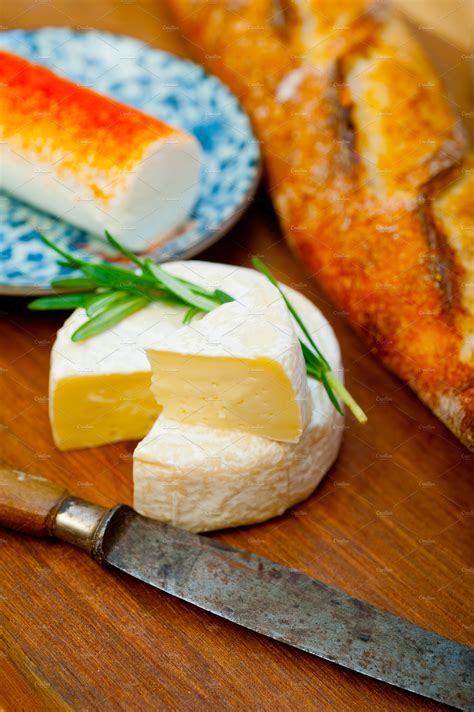 French cheese and fresh baguette on a wood cutter | Food Images ...