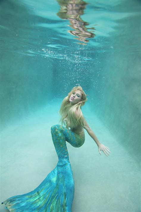 Mermaid Swimming Under Water Art Print by Ariel Skelley - Photos.com