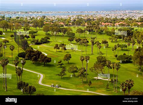 The verdant championship golf course at Newport Beach Country Club looks out to Newport Harbor ...