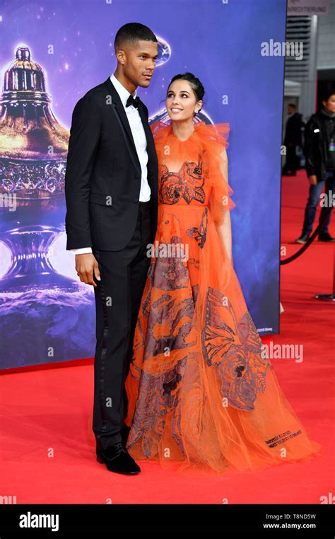 Naomi Scott and her husband Jordan Spence attending the 'Aladdin ...