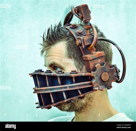 Man trapped by torture device ( Reverse Bear Trap from the Saw movie Stock Photo - Alamy