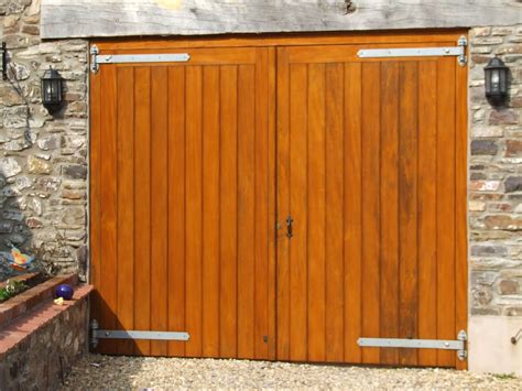 Hardwood garage doors coated with Sikkens light Oak stain and fitted with galvanized fittings ...