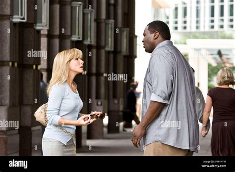 SANDRA BULLOCK as Leigh Anne Tuohy and QUINTON AARON as Michael Oher in ...