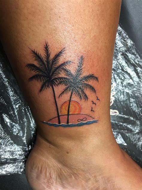 Palm Tree Tattoo with a beautiful sunset on a beach. Infinity in the sand | Sunset tattoos, Palm ...