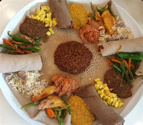 [I ate] Ethiopian platter served with injera, lentils, beans and vegetables : food