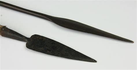 An African Assegai type spear, with leather grips, 112cm, with an Arifan tribal short spear with