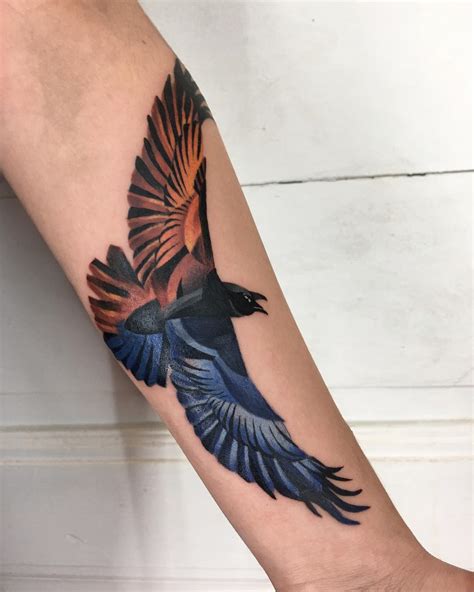 A flame colored raven tattoo by Mavka Leesova - Tattoogrid.net