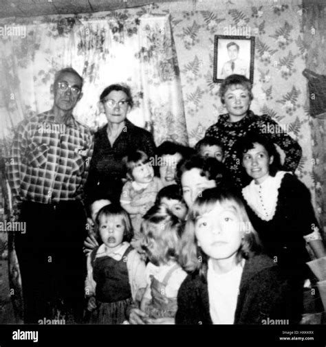 Photograph of Dolly Parton (upper right in the back) and family at Christmas in 1960. © Nancy ...