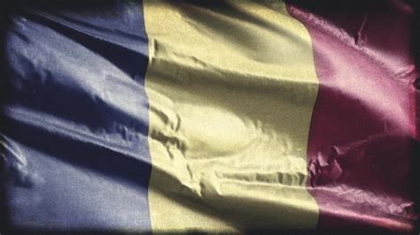 Retro aged Romania flag waving on the wind. Old vintage Romanian banner swaying on the breeze ...