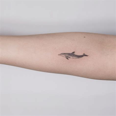 Beautiful small dolphin tattoo - Tattoogrid.net