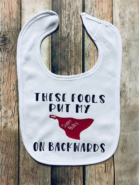 Funny Baby Bib | These Fools put My Cape On Backwards | Super Baby Bib ...