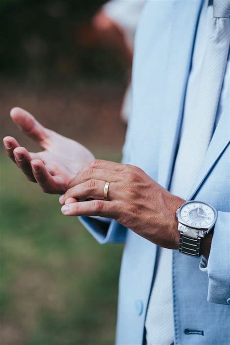 Man Hand with Wedding Ring and Wristwatch · Free Stock Photo