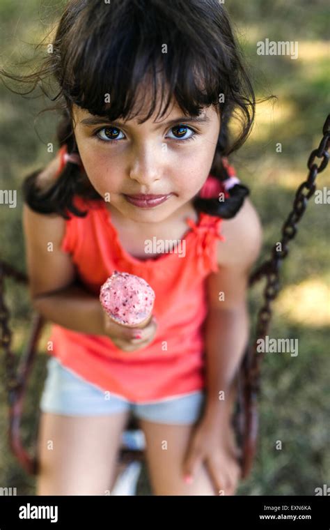 Portrait of little girl with ice cream cone Stock Photo - Alamy