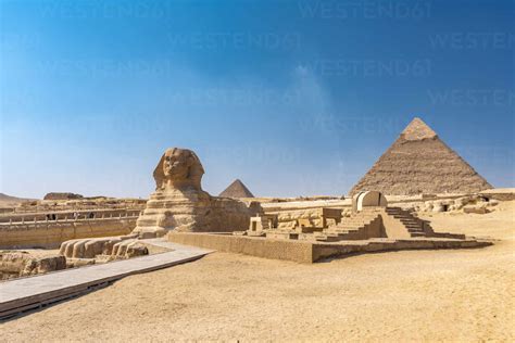 Egypt, Giza Governorate, Giza, Great Sphinx of Giza and Giza Pyramids stock photo