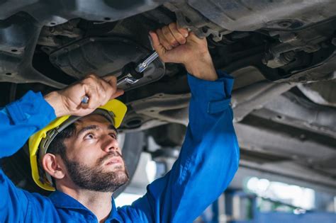 Free Stock Photo of Mechanic repairing car damage at auto shop ...