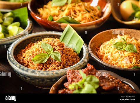 Serundeng Kelapa. Savoury toasted grated coconut. A side dish for Nasi Ulam Betawi Stock Photo ...