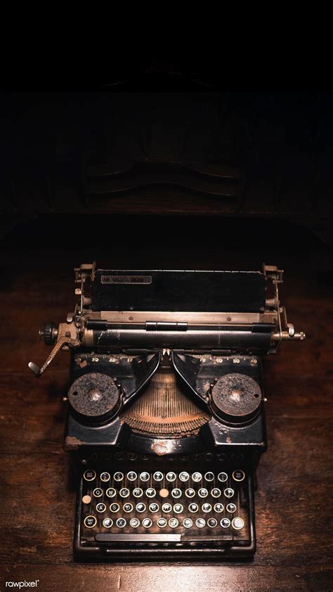 Download premium image of Old typewriter on a wooden table mobile phone in 2020 | Classic phones ...