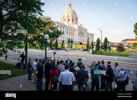 Gov. Tim Walz, with his wife Gwen Walz, hold a news conference after ...