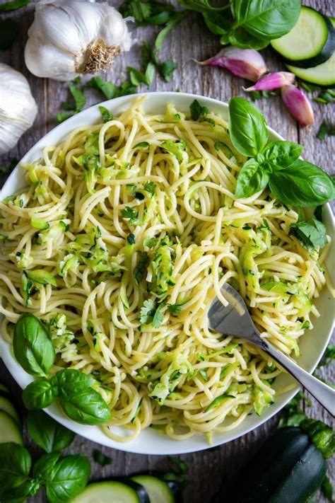 Garlicky pasta recipe that is tossed in sautéed zucchini and topped with shredded parmesan. A ...