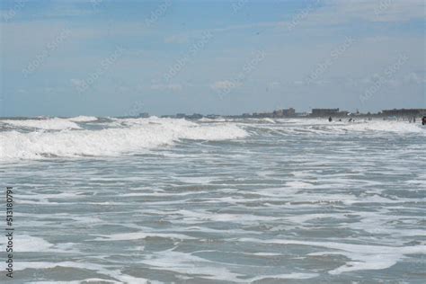 surf at the beach and jetty Stock Photo | Adobe Stock