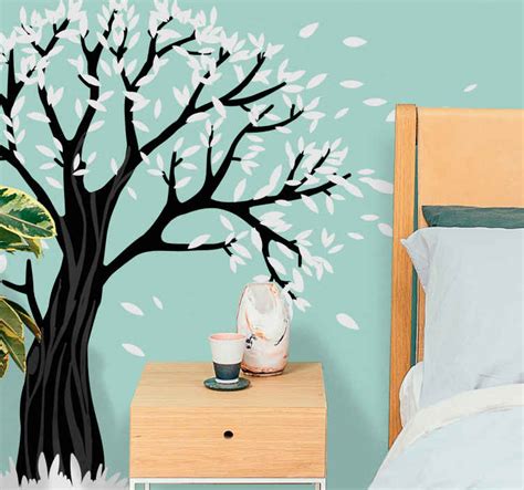 Modern black and white tree with flying leaves wall sticker - TenStickers