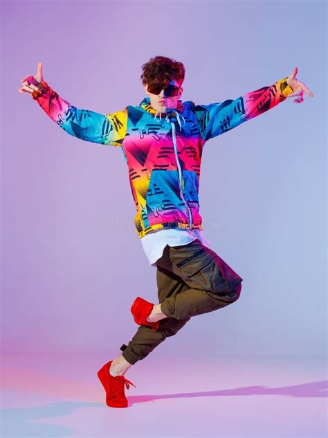 Boy Dancing In Neon Light Studio. Acrobatic Dancer. Stylish Flex. Stock ...