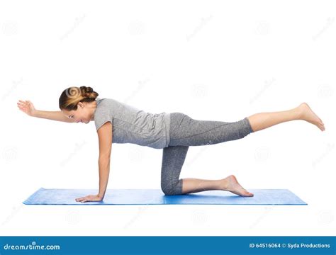 Woman Making Yoga In Balancing Table Pose On Mat Stock Photo - Image ...