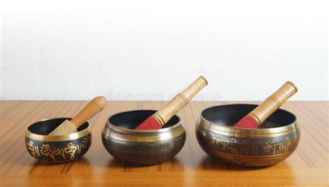 Three Tibetan Bowls on a Wooden Table with White Wall Background Stock Photo - Image of relax ...