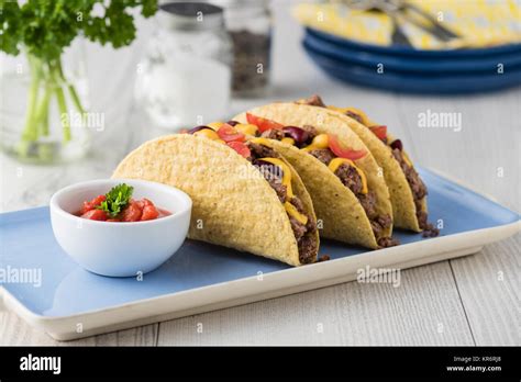 Mexican tacos with beef, cheddar cheese, tomato Stock Photo - Alamy