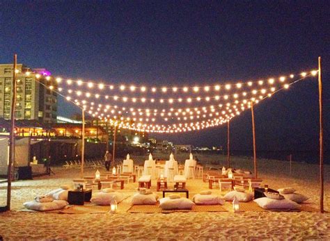 romantic and intimate beach party set up | Beach dinner parties, Beach dinner, Beach bonfire parties