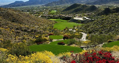 Hole 15 of Arthur Hills designed Mountains Course at Bighorn - Par 4. From a tee overlooking the ...