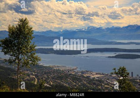 View of 'Molde panorama' taken from Varden viewpoint - showing the fjord and the snow clad peaks ...