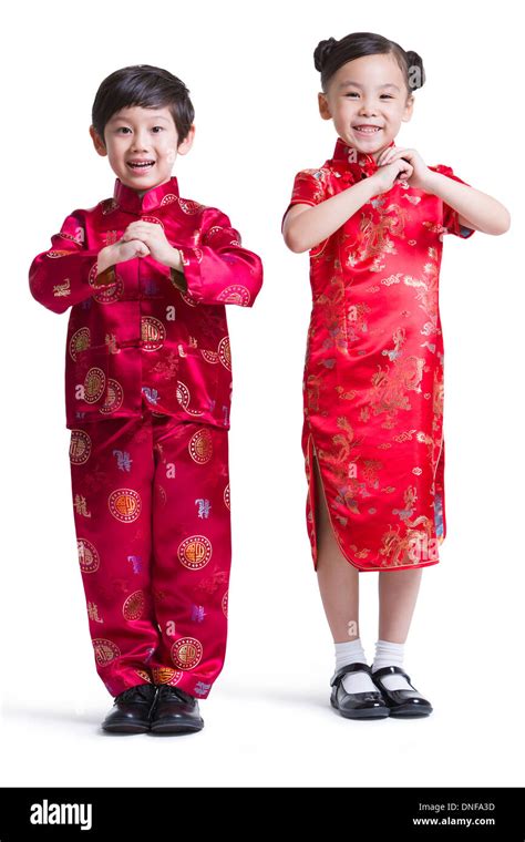 Cute children in traditional clothing celebrating Chinese New Year Stock Photo: 64876097 - Alamy