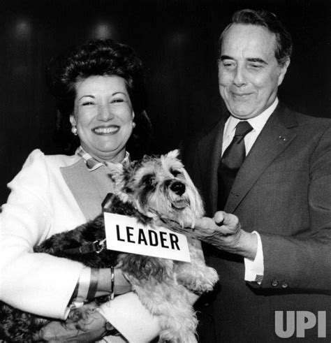 Photo: Elizabeth Dole presents her husband Robert Dole with a new dog ...