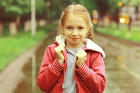 Premium Photo | Girl 6 years old spring rain