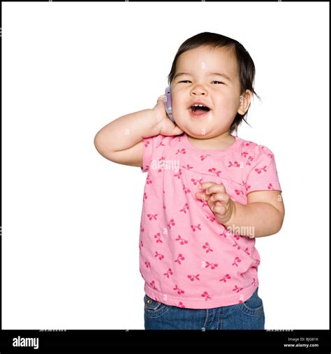 baby girl in a pink t-shirt Stock Photo - Alamy