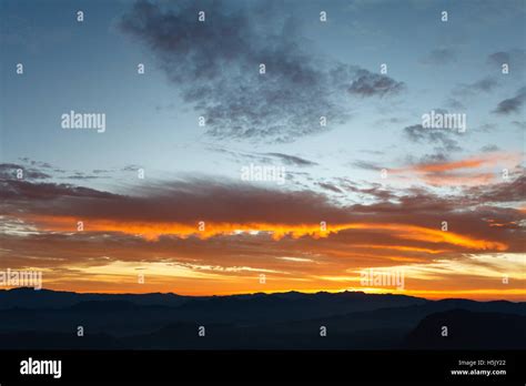 Sunrise at mountainside Stock Photo - Alamy