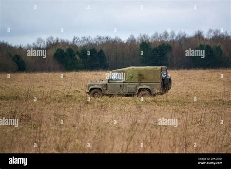 land rover defender wolf army medium utility vehicle on a military ...