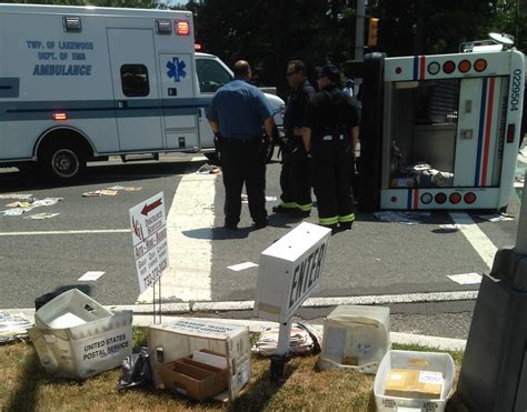 PHOTOS: 2 Hospitalized after Collision which left USPS Truck Overturned - The Lakewood Scoop