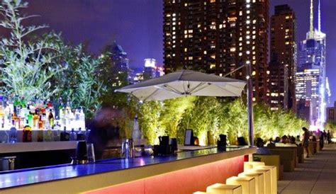 Yotel New York Rooftop Bar with peeks at the Hudson River between skyscrapers. #jetsettercurator ...