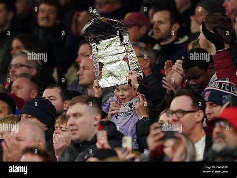 A Liverpool fan with a foil FA cup trophy replica during the Emirates ...