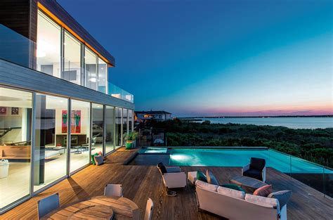 Stylish Glass Homes with Beautiful Views | Beach house exterior, Waterfront homes, Dream beach ...