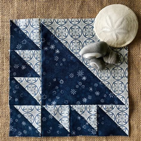 Lady of the Lake is a classic quilt block constructed of half-square triangles: one large unit ...