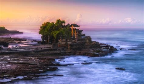 Premium Photo | Tanah lot temple at sunrise in bali, indonesia.