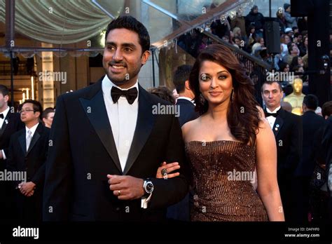 Indian actress Aishwarya Rai Bachchan (R) and her husband Abhishek Bachchan arrive for the 83rd ...