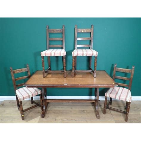 An oak Refectory Table and four oak Dining Chairs