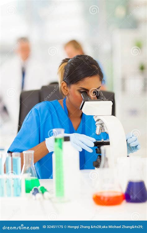 Scientist Looking Through Microscope Royalty Free Stock Photo - Image: 32451175