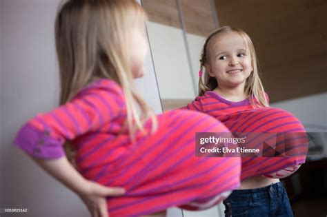 Child Pretending To Have Pregnancy Belly High-Res Stock Photo - Getty Images