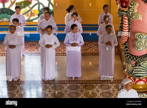 Female followers at Cao Dai temple, Tay Ninh, Vietnam Stock Photo - Alamy